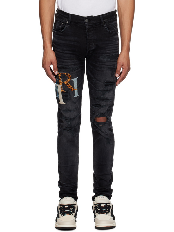 AMIRI STAGGERED LOGO JEANS BLACK