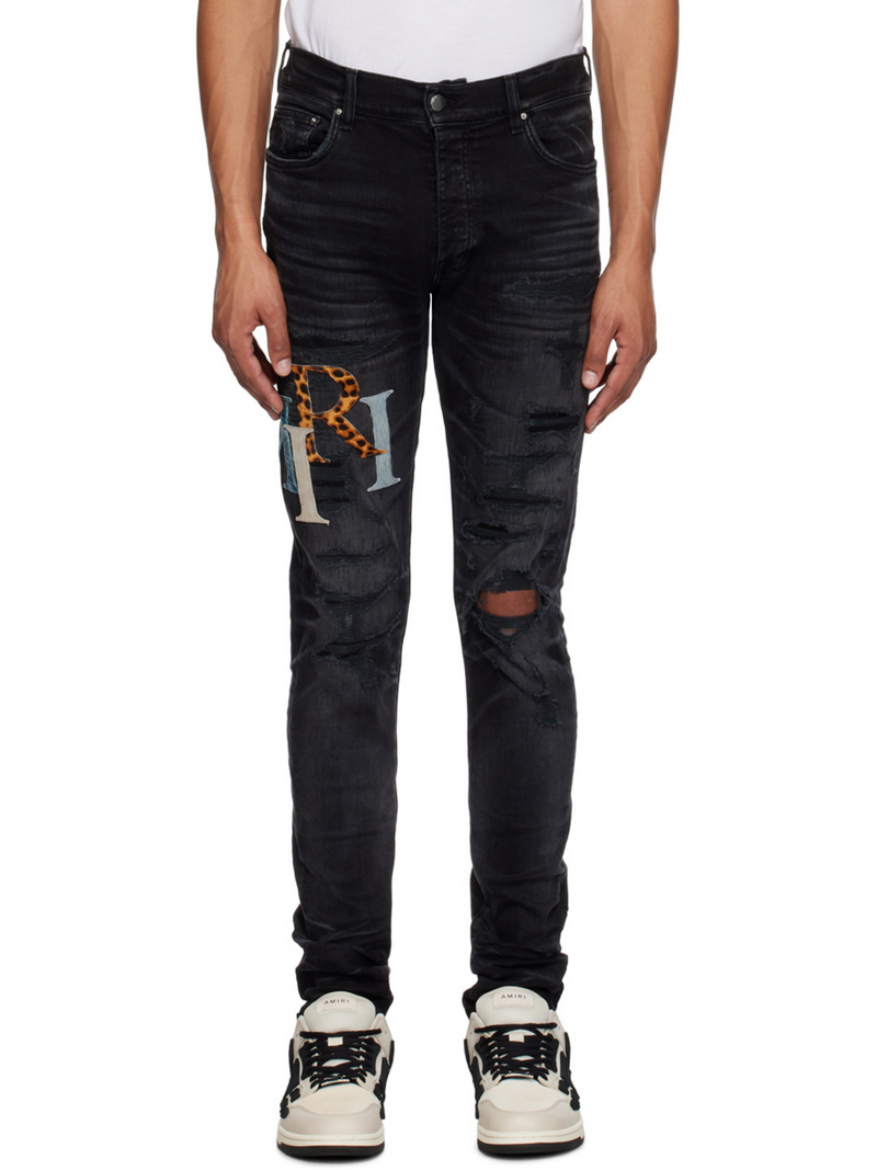 AMIRI STAGGERED LOGO JEANS BLACK