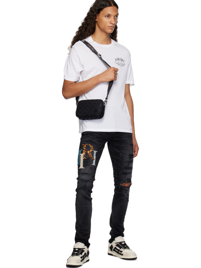AMIRI STAGGERED LOGO JEANS BLACK